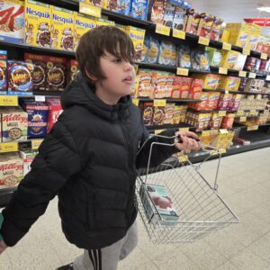 Young person taking part in a shopping and budgeting life skills activity