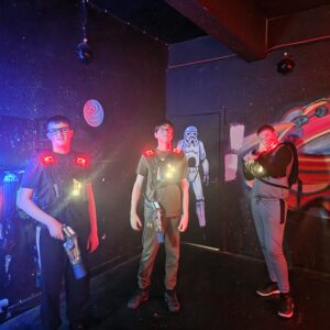 Young people taking part in an interactive laser tag activity