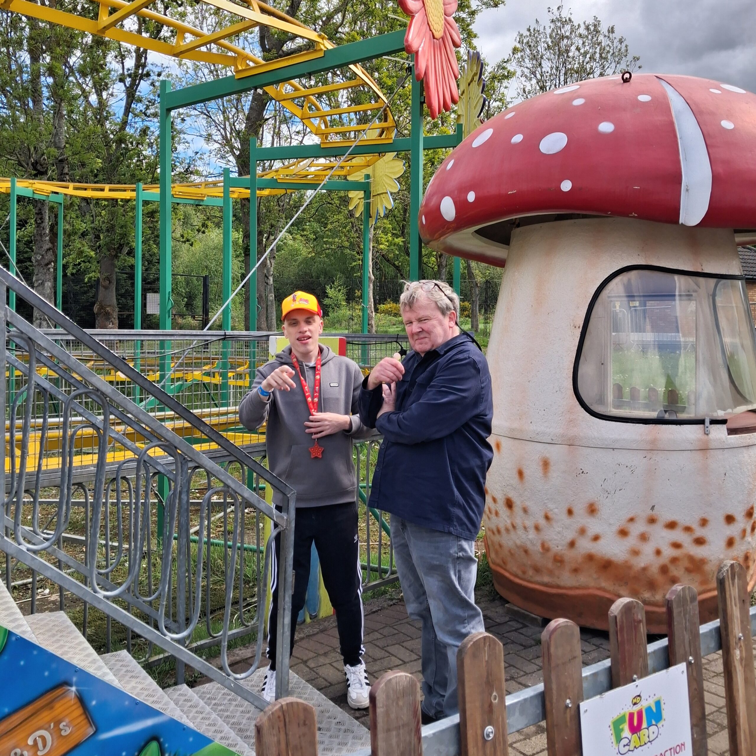 Young person enjoying a community outing at a theme park attraction