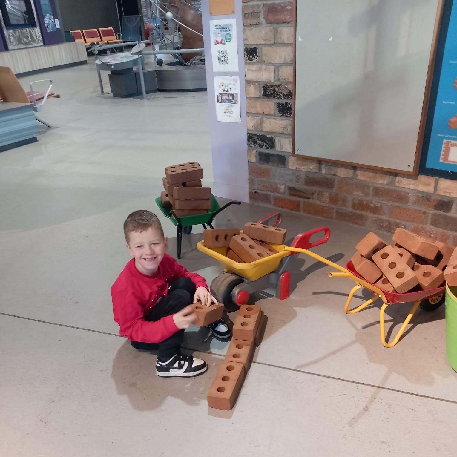 Child building and exploring construction play activities