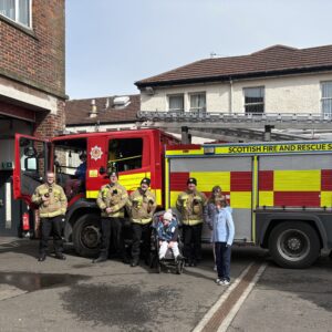 Young people visiting the local fire station with Scottish Fire and Rescue Service staff