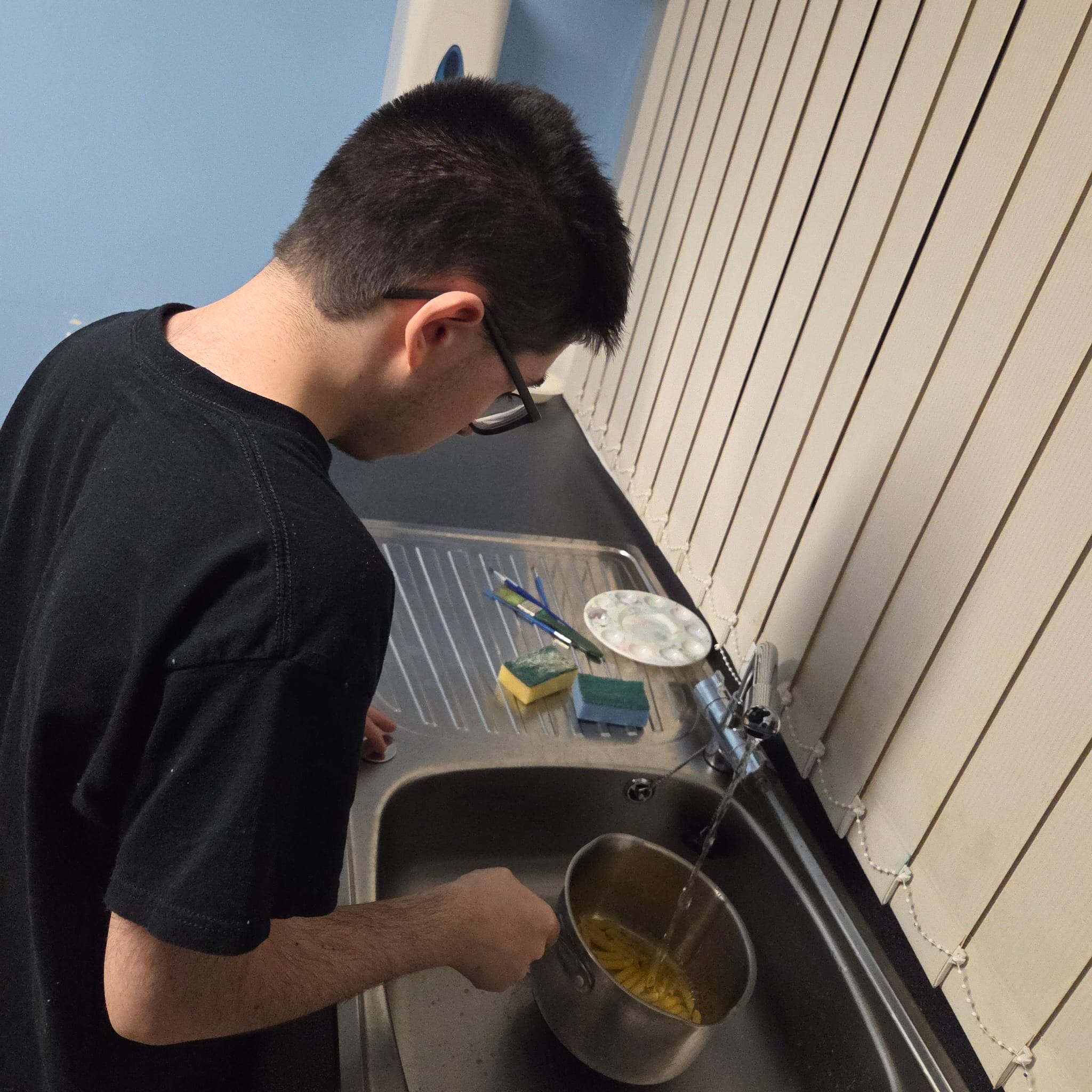 Young person practising cooking and kitchen life skills